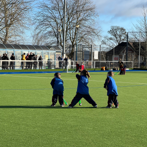 students playing hockey